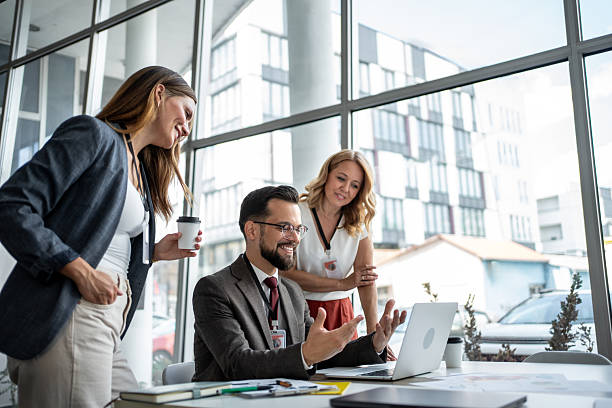 istock Business team discussing work on laptop in modern office 2227505093