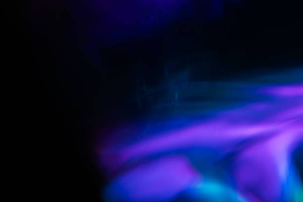istock Abstract blurred colorful lens flare bokeh on black, 2227505268
