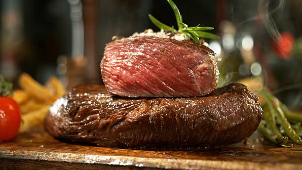 istock Delicious beef steak on wooden table 2227506653