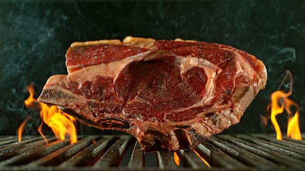 istock Close-up of Beef Steak on a Grill 2227506691