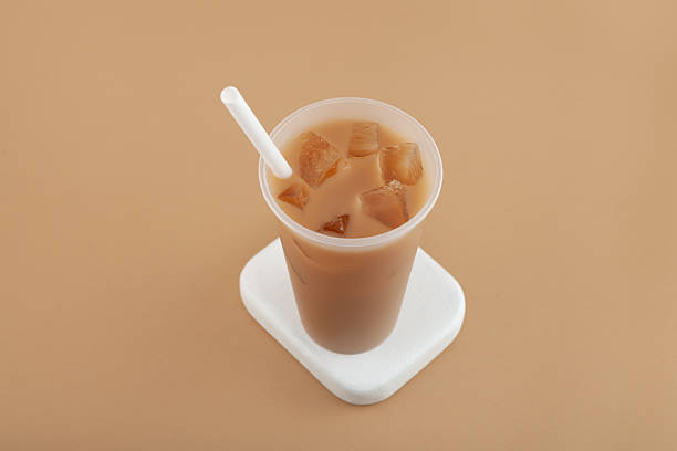 istock Hong kong milk tea mixed with iced ersatz coffee in disposable plastic cup. Refreshing cold drink. Take away street food beverage 2227506785