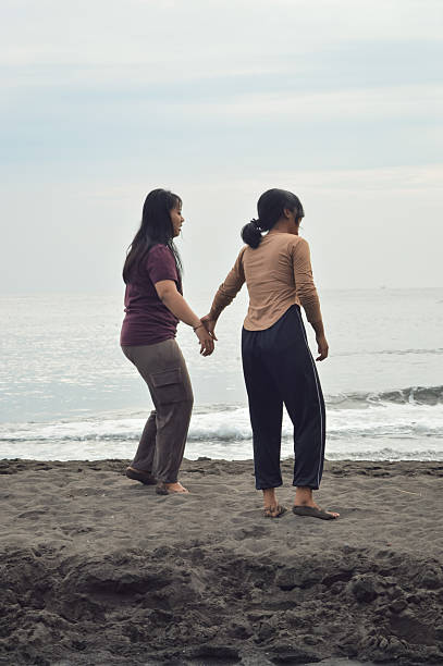 istock Girls pause mid-walk, their attention drawn to something 2227508564