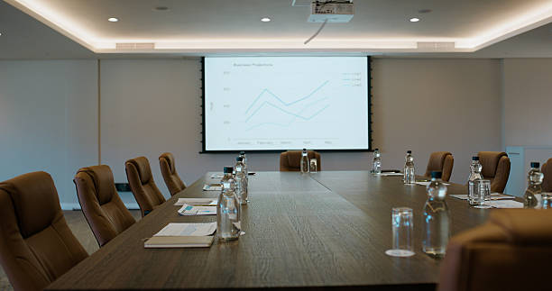 istock Conference room, screen and statistics with chairs for presentation, preparation or workshop. Empty space, technology or monitor with graph, chart or interior for business analysis, data or review 2227509505