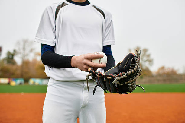istock Young player grips baseball in hand ready for play during youth game 2227509733