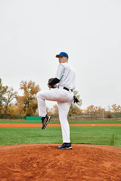istock Confident player ready to pitch on a vibrant baseball field in autumn 2227509846