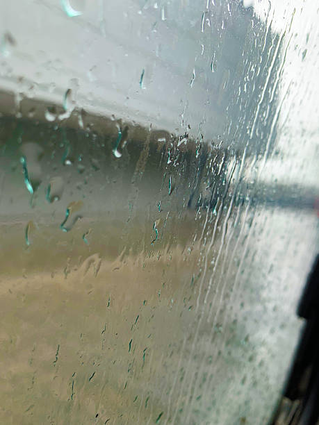 istock raining outside view from a car window vertical shot 2227510335