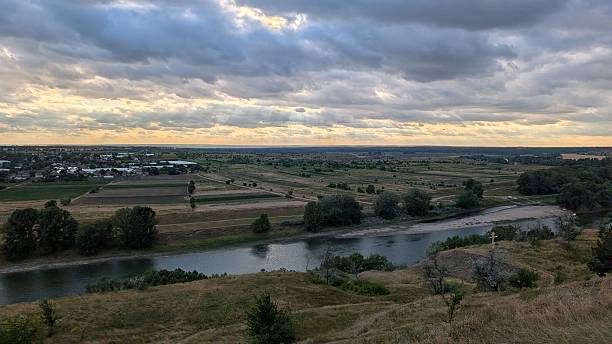 istock A breathtaking and scenic landscape showcasing a beautiful river beneath a dramatic sky 2227511051