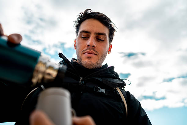 Young man drinking yerba mate outdoors