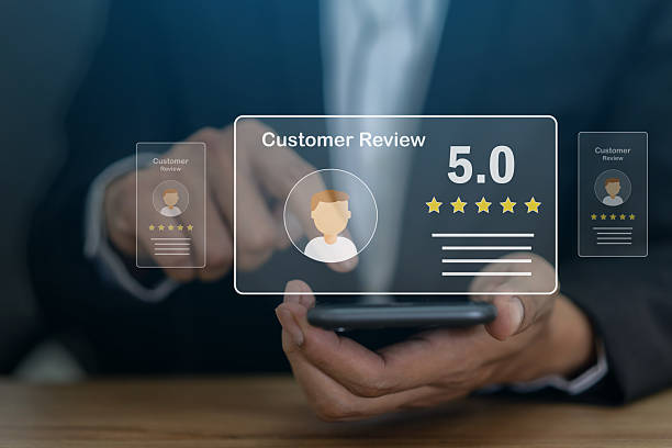 istock Customer satisfaction feedback with five star rating system, hand hold smartphone with digital smiley face quality service review, business evaluation, client experience, online review management 2227512749