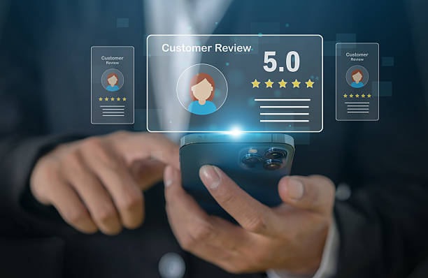 istock Customer satisfaction feedback with five star rating system, hand hold smartphone with digital smiley face quality service review, business evaluation, client experience, online review management 2227512754