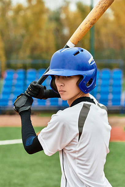 istock Dynamic teenage boy ready to hit a baseball on a sunny field during practice session 2227512957