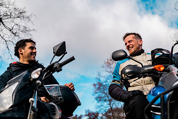 Motorcyclists talking during a ride outdoors