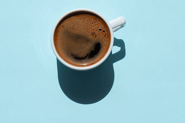 istock Directly Above View Of Coffee In Cup On Blue Background 2227513147