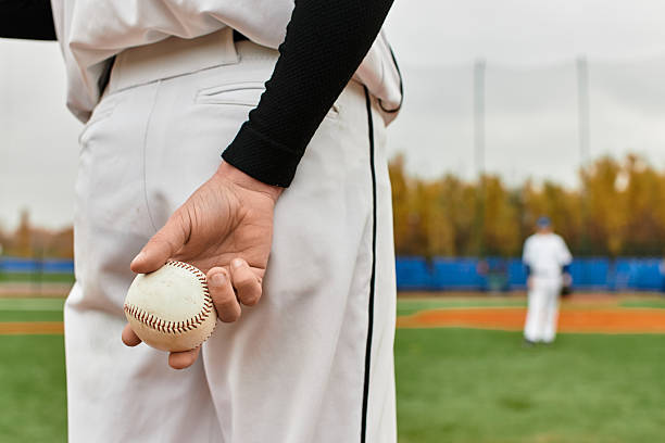 istock Player engaged in an exciting baseball match on a sunny field 2227514171
