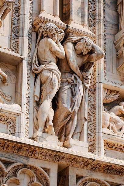 istock two figures hold Milans Cathedral relief 2227515354