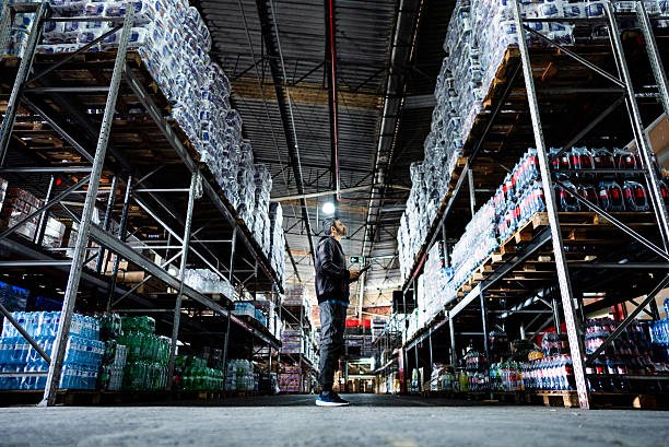 istock Mature businessman working on a digital tablet in a warehouse 2227515505