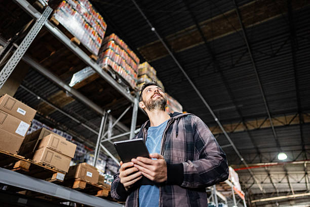 istock Mature businessman working on a digital tablet in a warehouse 2227515616