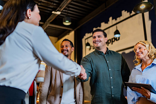 istock Coworkers talking at office 2227516450
