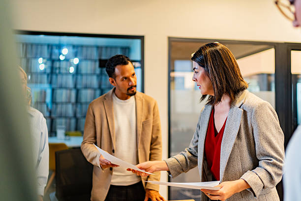 istock Coworkers talking during meeting at office 2227516460