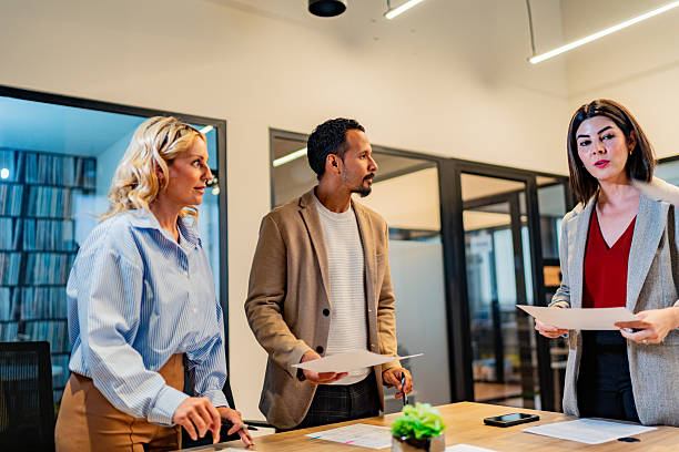 istock Coworkers talking during meeting at office 2227516463
