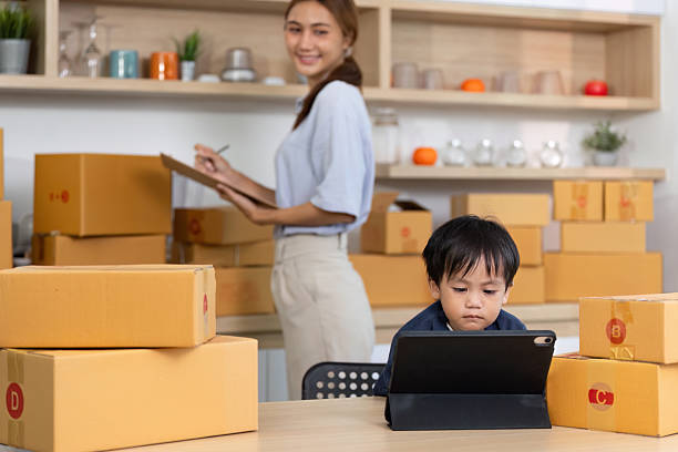 istock Mother and Child Collaborating in Home Workspace 2227516703