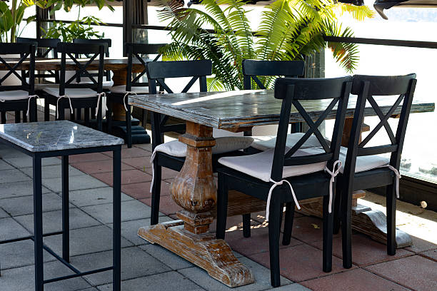 istock Empty tables and chairs in a restaurant, ready for your design. 2227517336