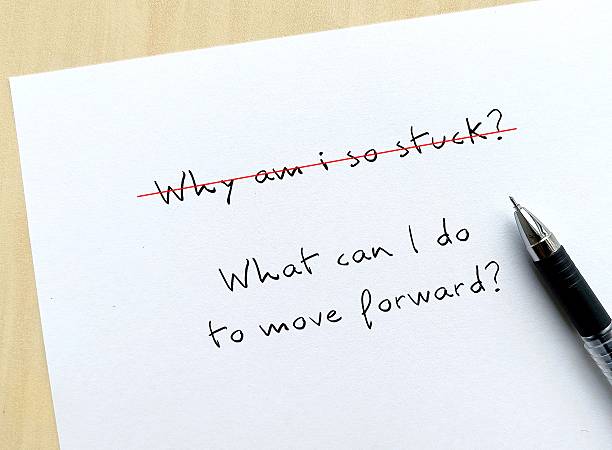 istock Question written - Why am i so stuck?  changed to  What can I do to move forward?  Means asking better questions to get better answer - focus on progress over perfection solutions rather than problem 2227517522