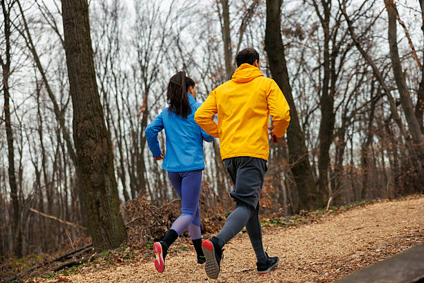 istock Active couple jogging in nature 2227518591