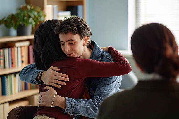 istock Multiethnic Teenagers Comforting Each Other during Counseling Session 2227520108