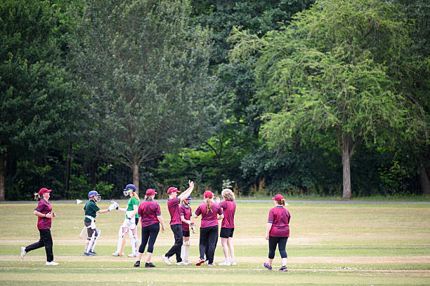 istock Wide shot fielding team high five celebrating as successful game 2227520314