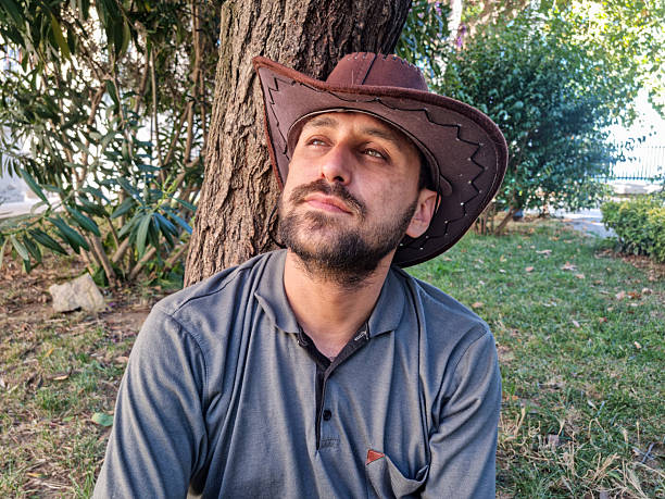 Man in cowboy hat in public park