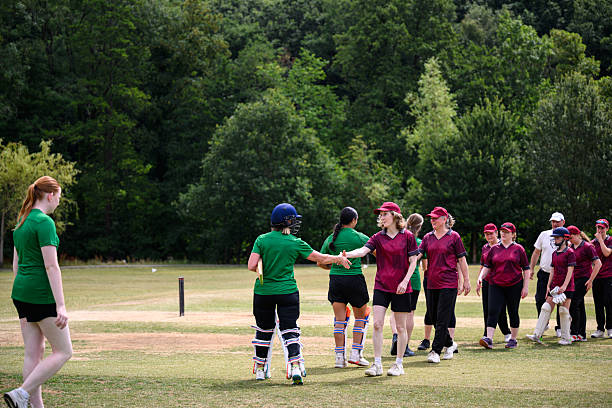 istock Womens cricket teams line up and shake hands after the game 2227520361