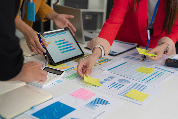 istock Businessmen team or financial data analysts working with tablets and laptop computers and data graphs together. Plan to analyzing projects in the office. 2227520699