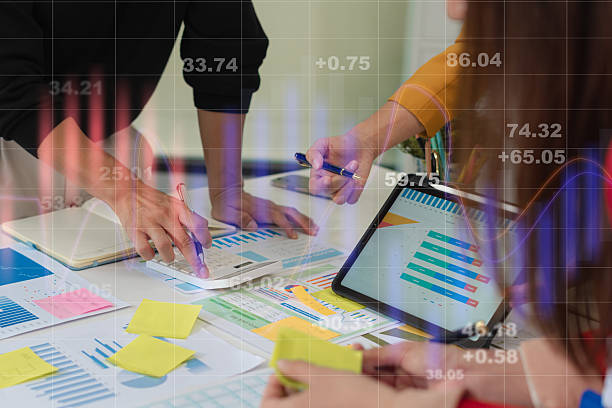 istock Businessmen team or financial data analysts working with tablets and laptop computers and data graphs together. Plan to analyzing projects in the office. 2227520710