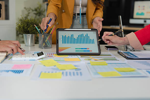 istock Businessmen team or financial data analysts working with tablets and laptop computers and data graphs together. Plan to analyzing projects in the office. 2227520721