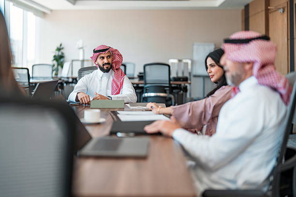 istock Confident Diverse Business Executives Collaborating in a Modern Open Plan Office Environment 2227521029