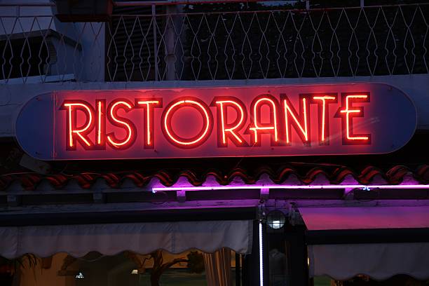 Ristorante neon sign. Ristorante means restaurant in Italian. Generic restaurant illuminated night sign in Italy.