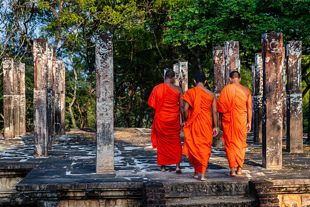 istock Sri Lankan buddhist monks walking inside an ancient temple, Ceylon 2227526120