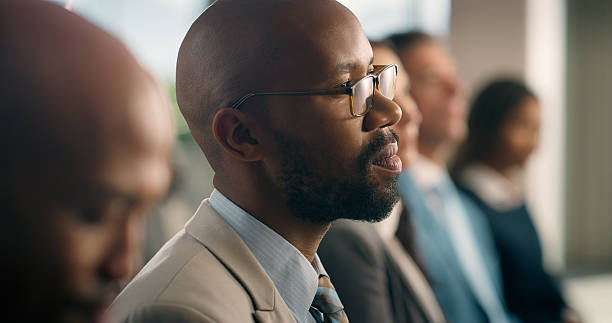 istock Seminar, listening and audience with man for business convention, workshop and growth. Project pitch, corporate guest and forum talk with crowd of people for education, conference and development 2227526876