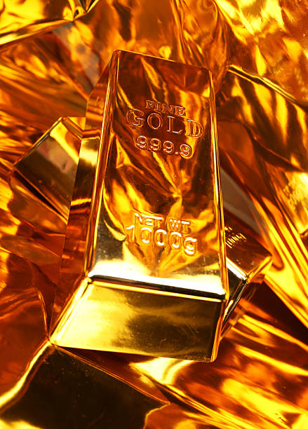 istock Two gold bars on a golden background 2227536477