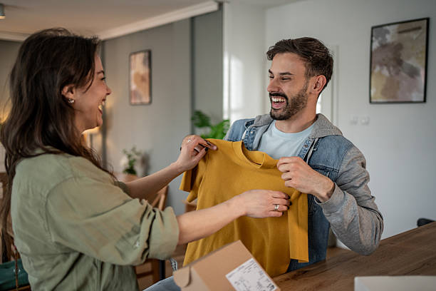 istock Young couple unpacking online order at home 2227537097
