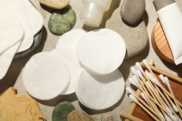 istock Flat lay composition with cotton pads and swabs on grey textured table 2227539967
