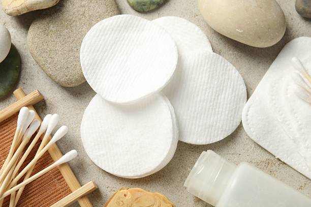 istock Flat lay composition with cotton pads and swabs on grey textured table 2227539979