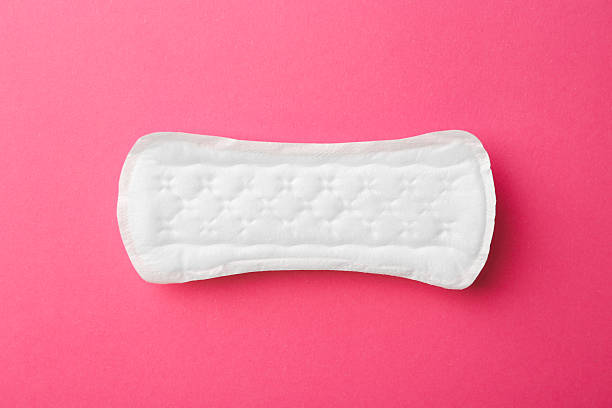 istock Menstrual pad on pink background, top view 2227540689