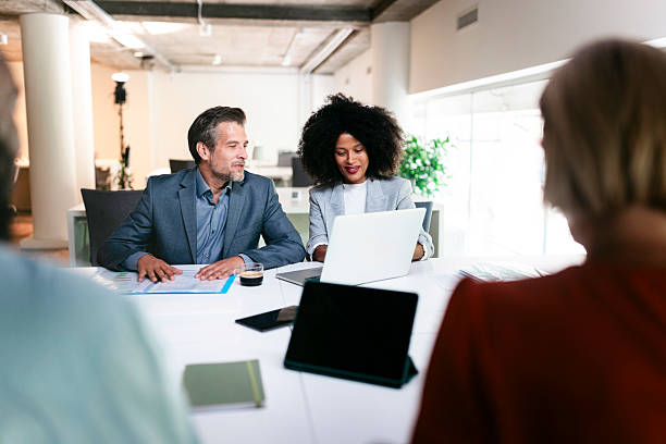 istock Business people working together on a project using laptop in the office 2227541017