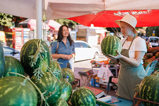 istock Summer Shopping for Ripe Watermelon 2227541055