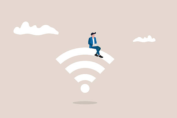 istock Businessman sitting on wifi. Concept of internet connection, wireless communication, and remote work 2227542309