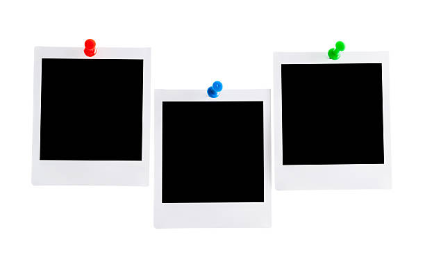 istock Three blank photos isolated pinned with a pin for paper on white background 2227543047