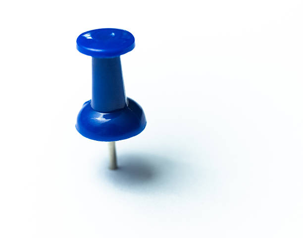 istock Round blue thumbtack with shadow on white background 2227543101