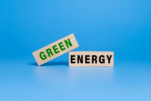 istock green energy words text on wooden blocks isolated on blue background 2227543365